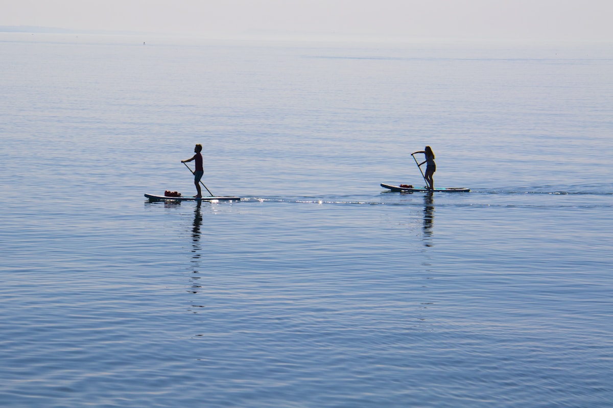 SUP board on crystal clear water