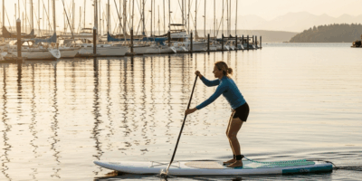 paddleboard Shilshole Bay Marina Seattle sailboats sunset